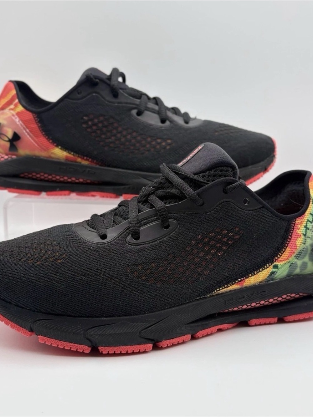 Under Armour Women's Black Running Shoes with Red and Yellow Accents
